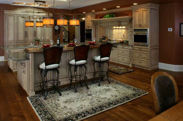 wooden kitchen with pendant lighting and dark wood floors