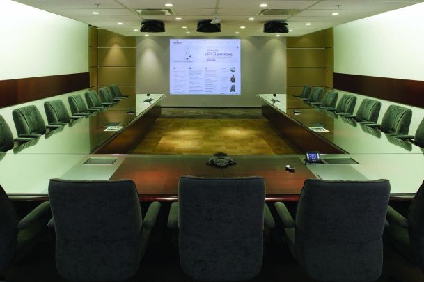 Board Room with charcoal chairs and projector screens