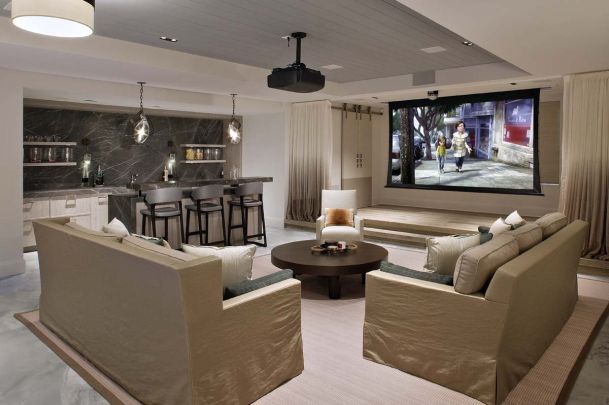 Media Room with white walls and couches