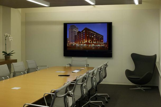 conference room with large screen tv on wall